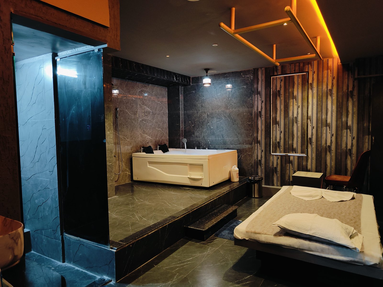 Therapist providing a relaxing spa treatment with essential oils at Heritage Spa