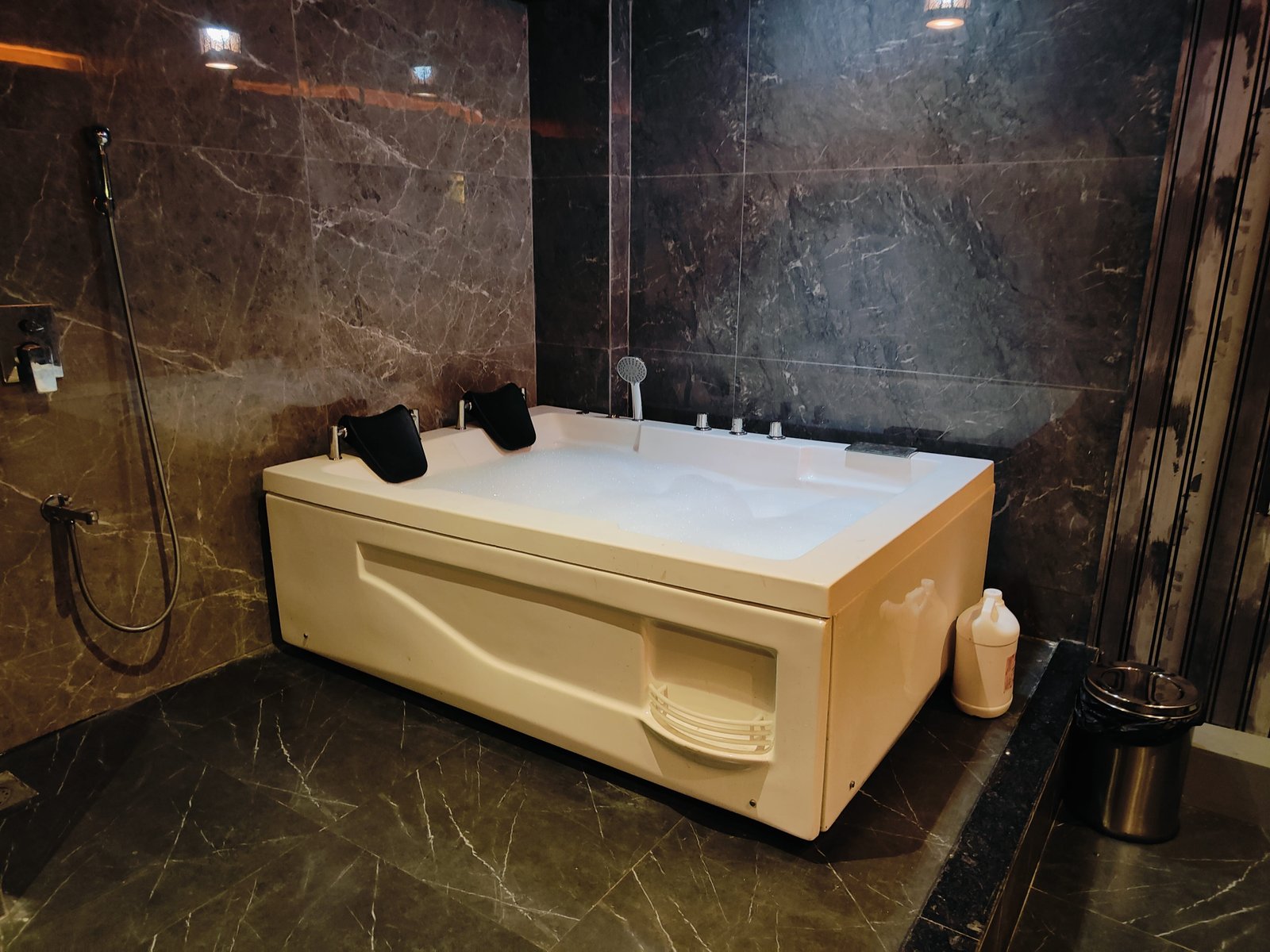 Therapist providing a relaxing spa treatment with essential oils at Heritage Spa