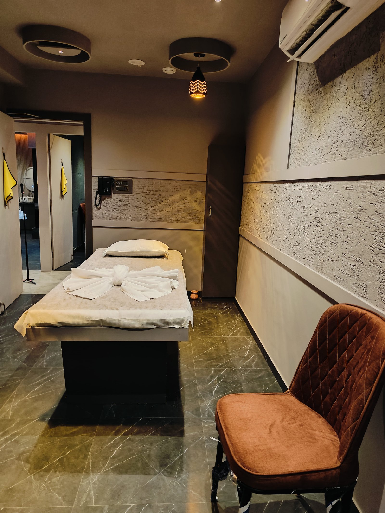 Modern spa room at Heritage Spawith soft lighting and comfortable massage tables