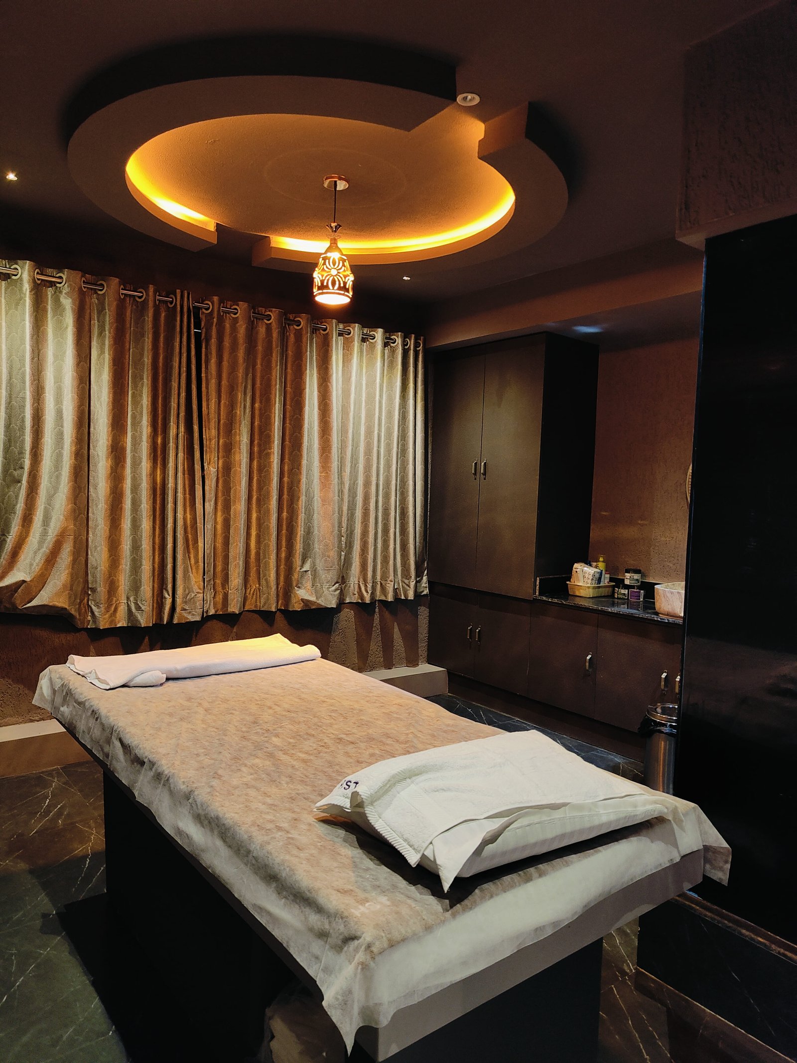Modern spa room at Heritage Spawith soft lighting and comfortable massage tables